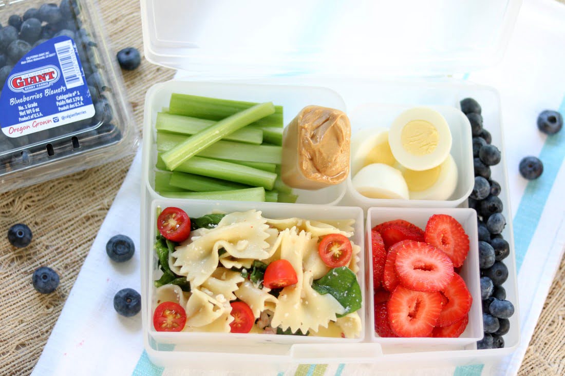 Back to school, Healthy tasty kid lunch box with sandwiches, nuts