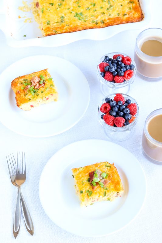 Breakfast casserole served with berries