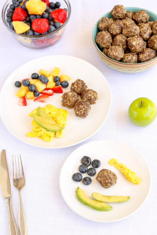 Breakfast meatballs with eggs fruit and avocado