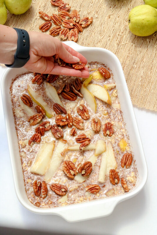 Adding pecans to baked oatmeal before going into the oven